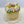 Load image into Gallery viewer, Pastel flower wreath cake with tulips, roses, and buttercream greenery, arranged in a ring on top of a rustic-finish yellow cake.