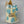 Load image into Gallery viewer, “Blue and beige birthday cake with baby sneakers on top, fondant balloon cluster, golden fans, and a ‘Happy Birthday’ topper.