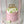 Load image into Gallery viewer, Pink birthday cake designed as a flower box with white and green tulip-shaped decorations and a ‘Happy Birthday’ topper, placed inside a transparent gift box.