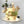 Load image into Gallery viewer, Birthday cake decorated with a giraffe, elephant, and zebra figurines, green and beige frosting, golden edible balls, and a ‘Happy Birthday’ topper.