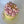 Load image into Gallery viewer, “Floral birthday cake with pink tulip-like buttercream flowers and green accents, featuring a ‘Happy Birthday’ topper.”