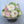 Load image into Gallery viewer, Elegant cake shaped like a bouquet of marshmallow roses in white, blush, and beige tones with leafy detail.