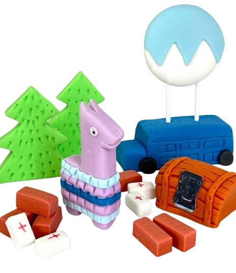Fortnite cake decoration set with fondant llama, trees, medkits, loot chest, bricks, and blue bus