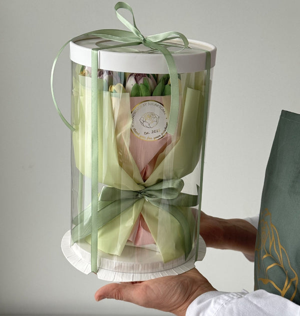 Edible marshmalow tulip bouquet in gift cylindrical box with green ribbon.