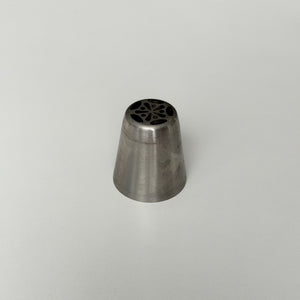 metallic tool with a star-shaped center on a light gray background