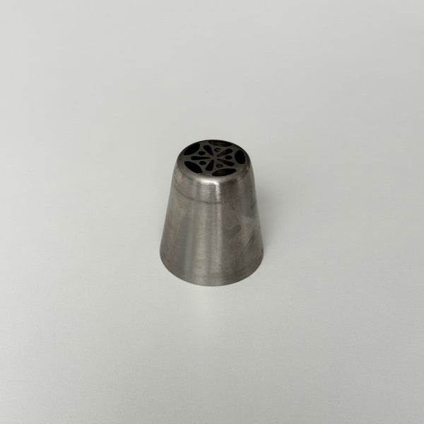 metallic tool with a star-shaped center on a light gray background