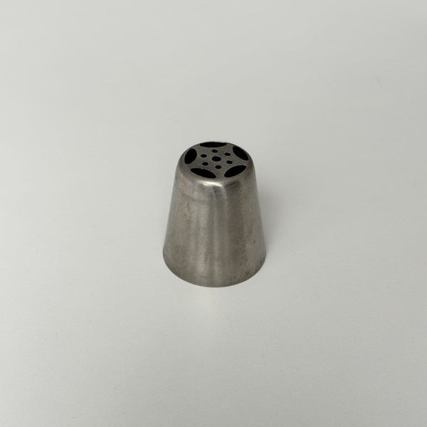 metallic cone-shaped object with a central hole on a light gray background