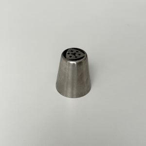 metal tip with multiple holes on a gray background