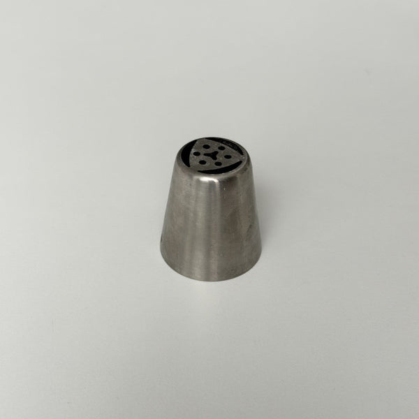 metal tip with multiple holes on a gray background