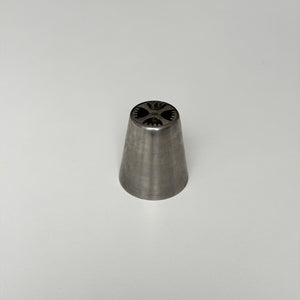 metallic cone-shaped object on a light gray background