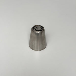 metallic cone-shaped object with a central spiral design on a light gray background