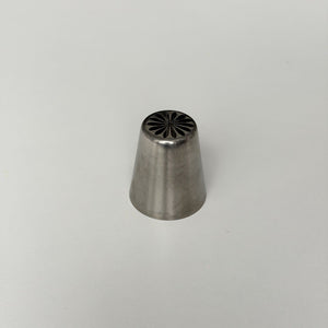 metallic tool with a textured top on a gray background