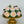 Load image into Gallery viewer, bouquet style marshmallow flower cake displayed on a gold stand
